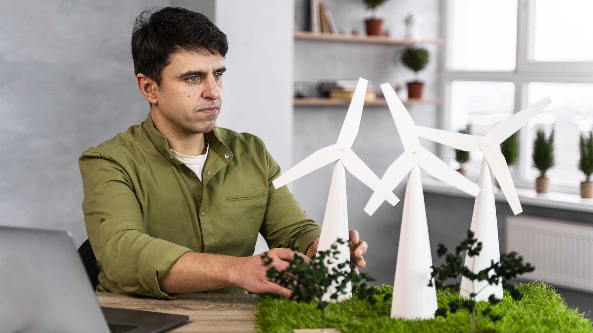 man-working-eco-friendly-wind-power-project-min